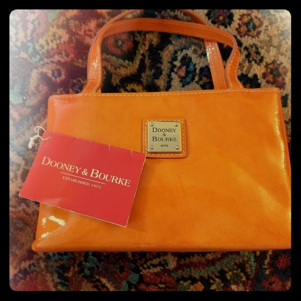 Nwt Dooney and Bourke bright orange mini purse
